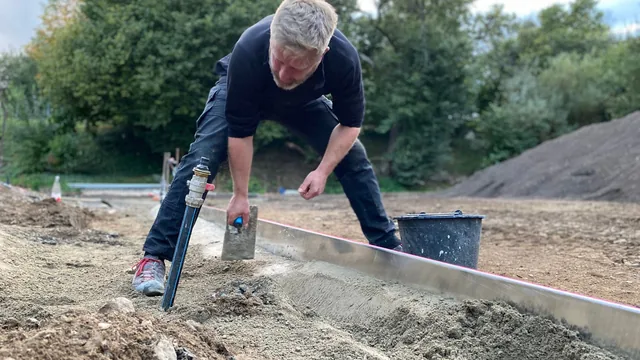 Jack leveling a sinking section of a house foundation in Henderson, NV