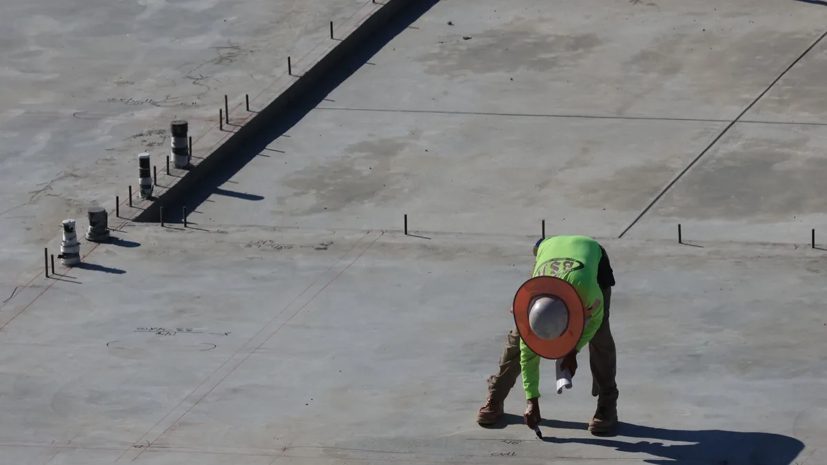 Hydraulic jack leveling a sinking slab foundation in Henderson, NV